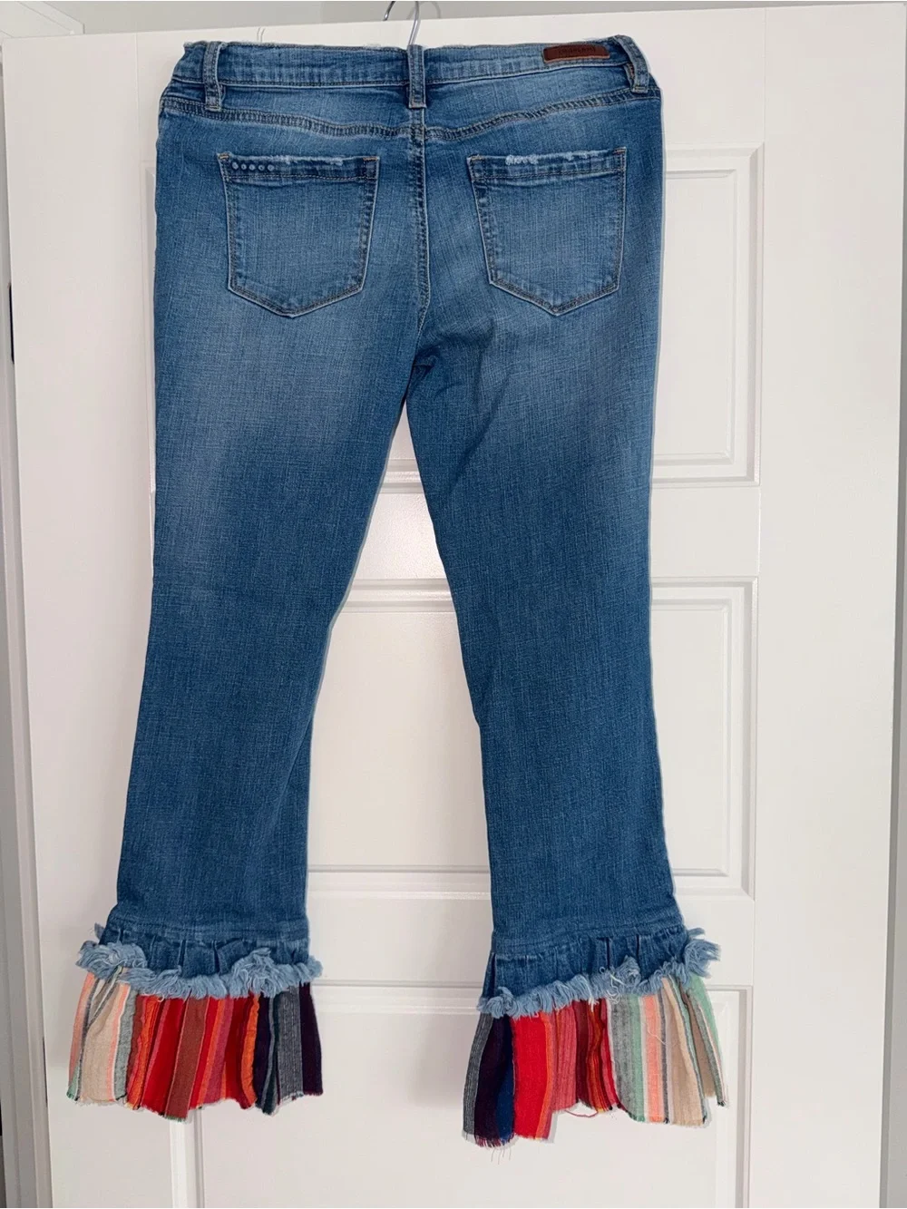 Blank NYC Blue Distressed Flare Jeans with Multicolor Ruffle Cuffs